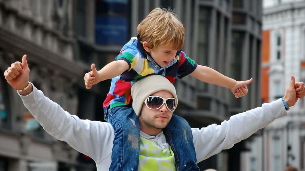 Father carrying his son on his shoulders
