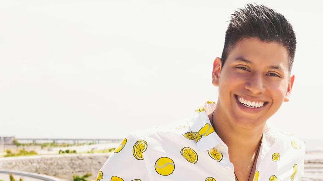A young man smiling
