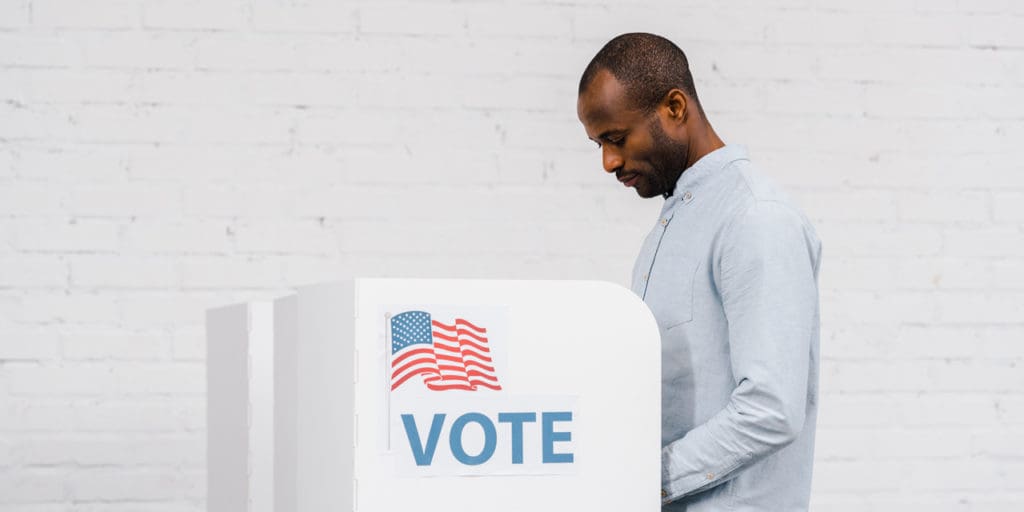 Man at voting booth