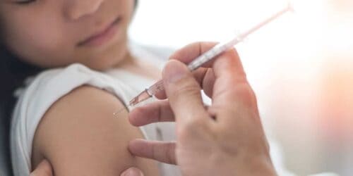 Young girl getting a vaccine
