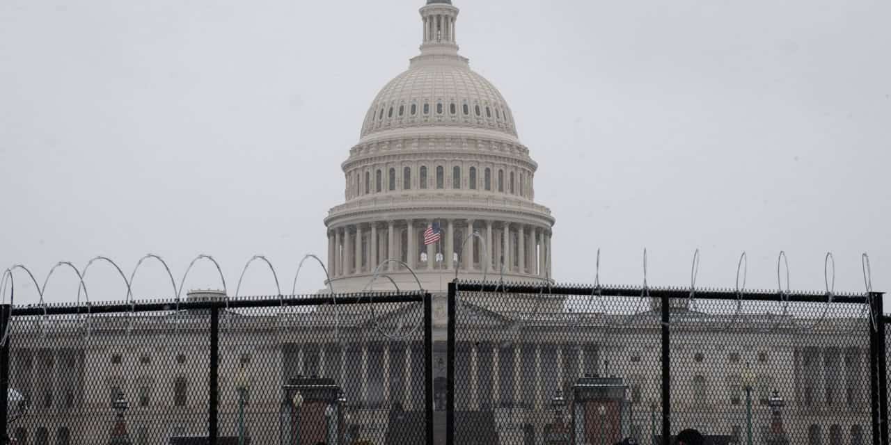 U.S. Capitol surrounded by barbed wire fences
