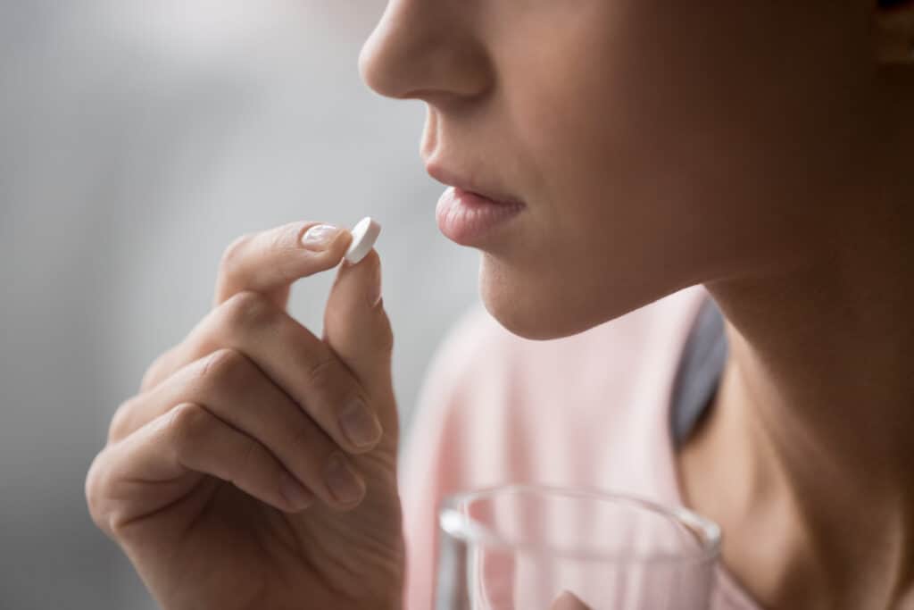 Woman Taking Pill
