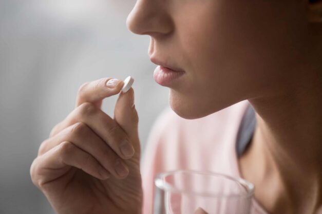 Woman Taking Pill