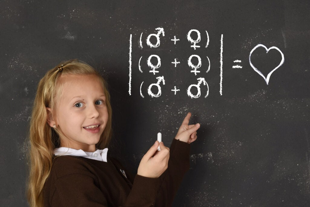 Schoolgirl writing on a chalkboard regarding sexual attractions between genders