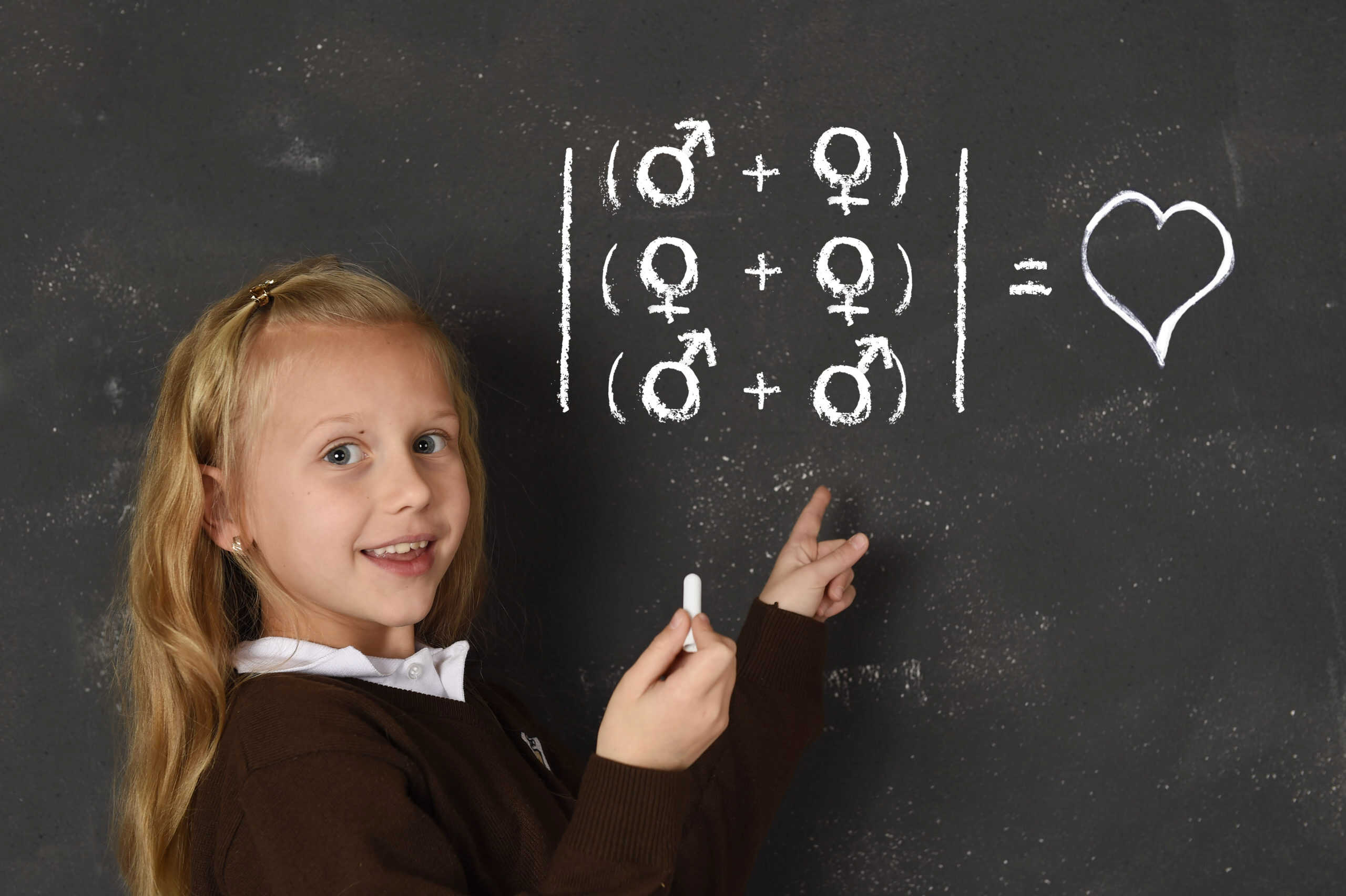 Schoolgirl writing on a chalkboard regarding sexual attractions between genders
